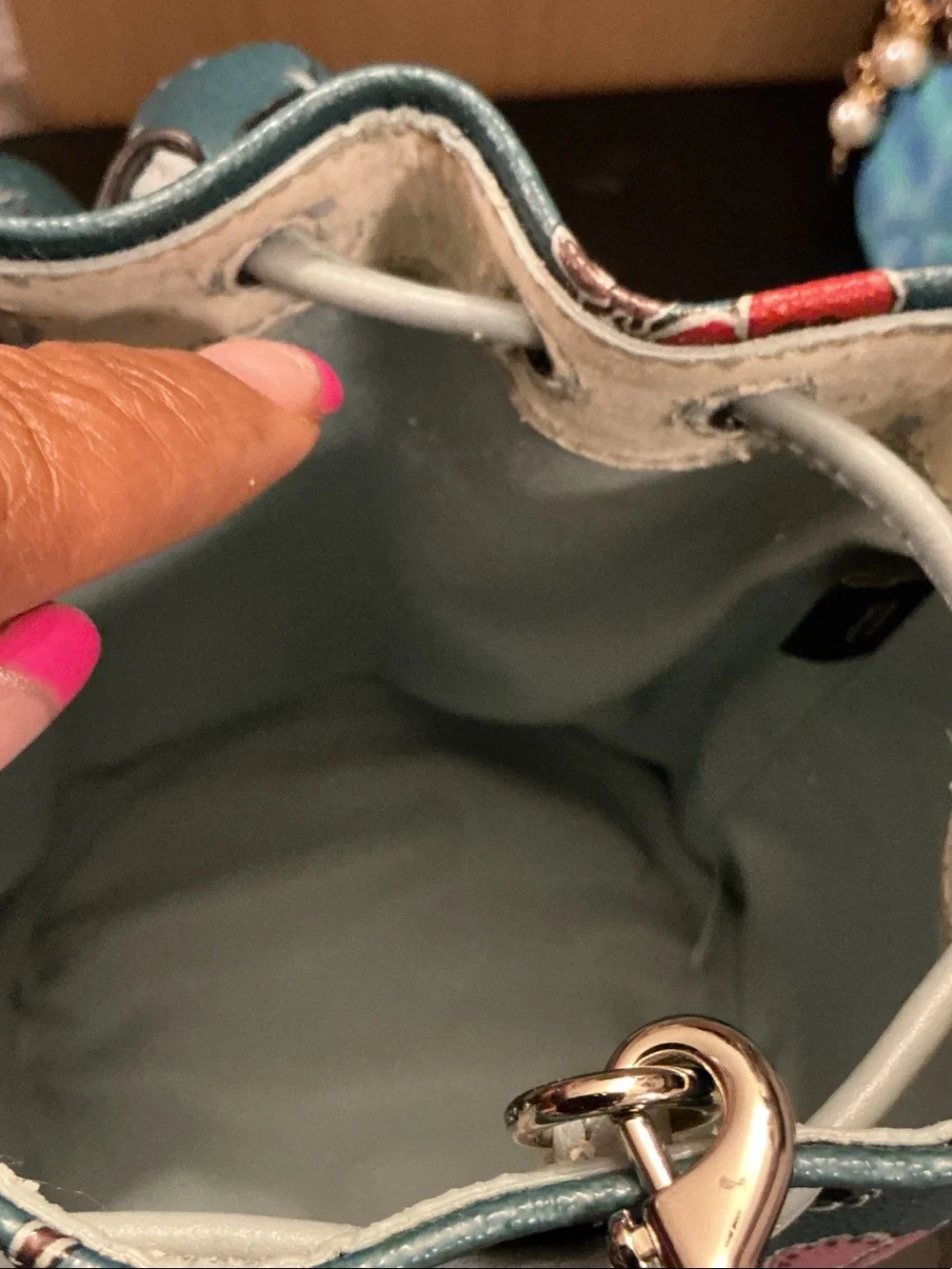 Coach Teal Floral Mini Drawstring Bucket Bag (rim has wear)